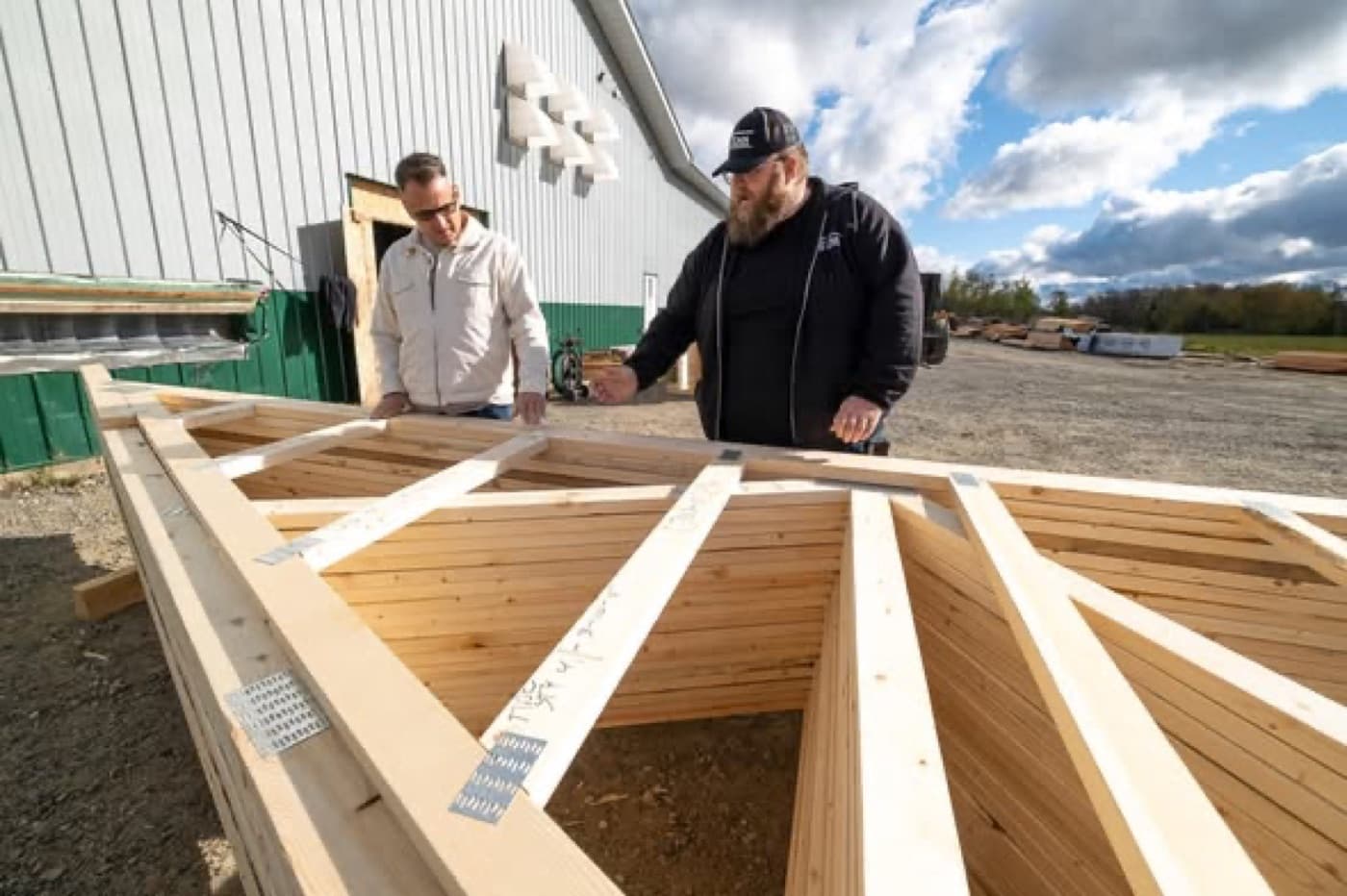 Titan staff reviewing a large commercial truss on site