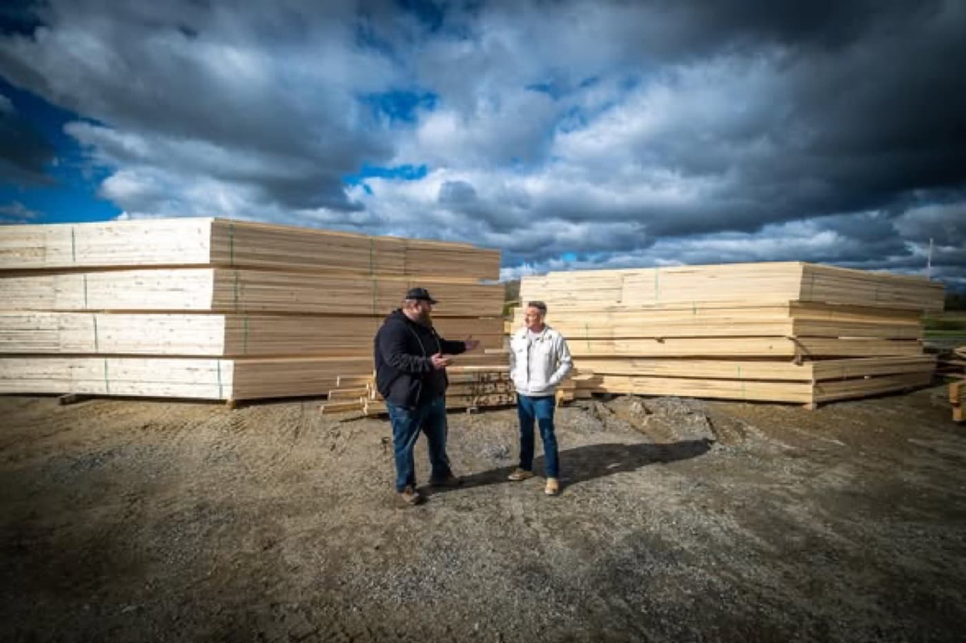 Two Titan Manufacturing team members reviewing an order in the truss yard